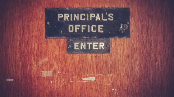Old sign on principals' office door