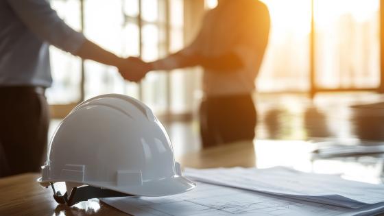 People shaking hands on construction deal